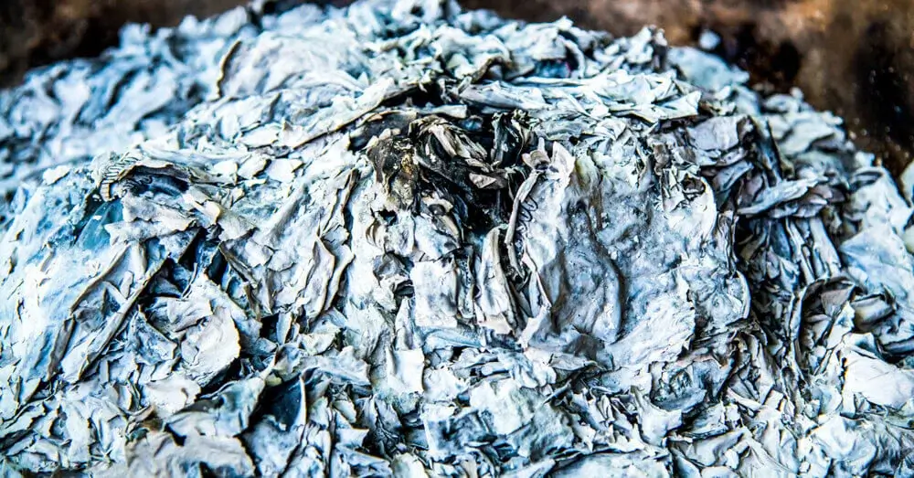 Pile of processed ash and debris in focus.