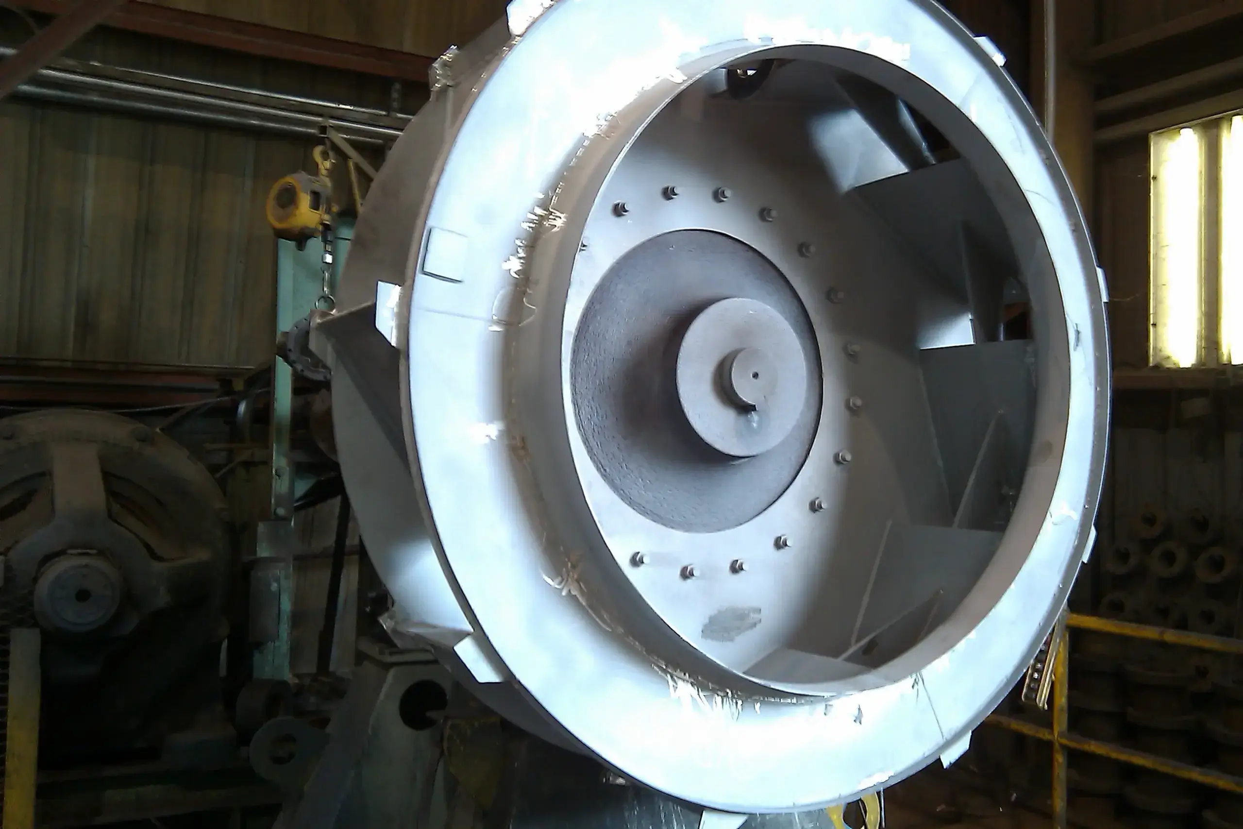 Large industrial fan in a workshop setting.
