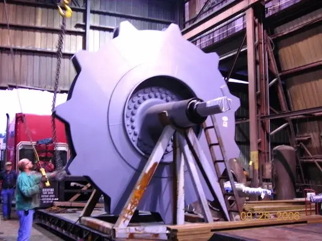 Large industrial fan being assembled in a factory.