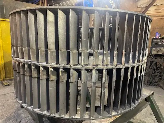 Large industrial fan with prominent metal blades.