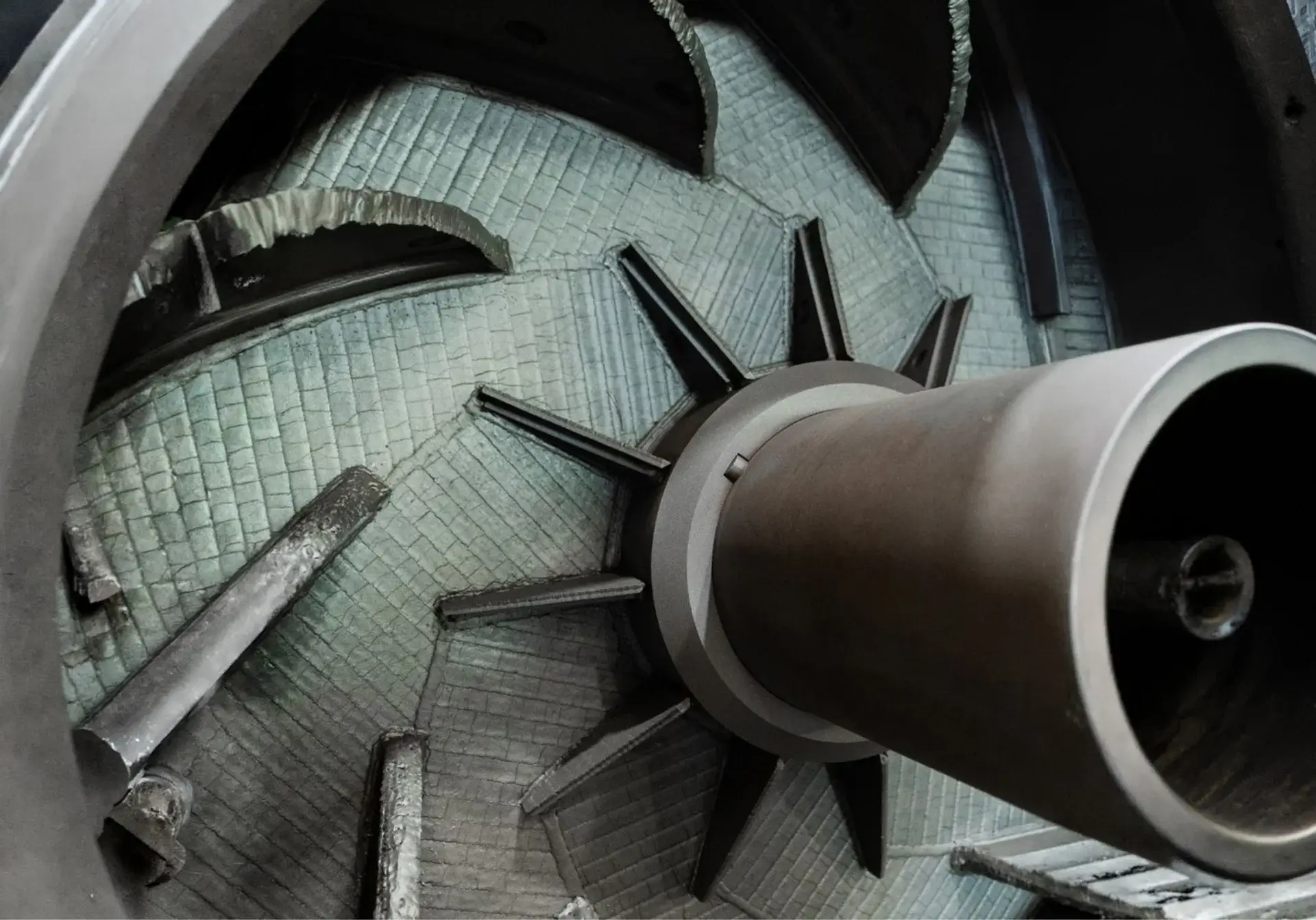 Industrial fan blades rotating with textured surface detail.