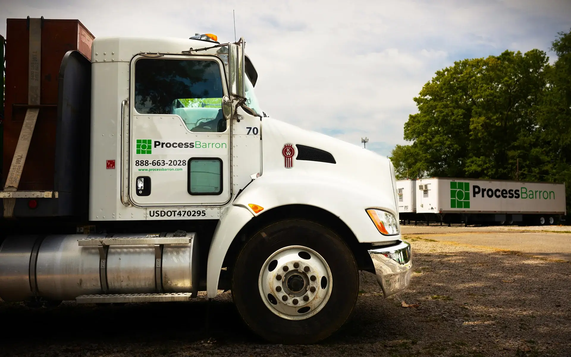 White truck parked with Process Barron branding visible.