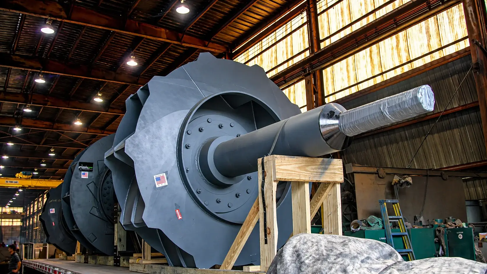 Large industrial fan in warehouse under construction.