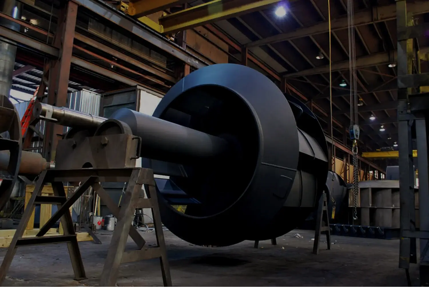 Large industrial fan part under construction in warehouse.