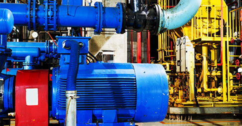 Blue industrial machinery in a factory setting.