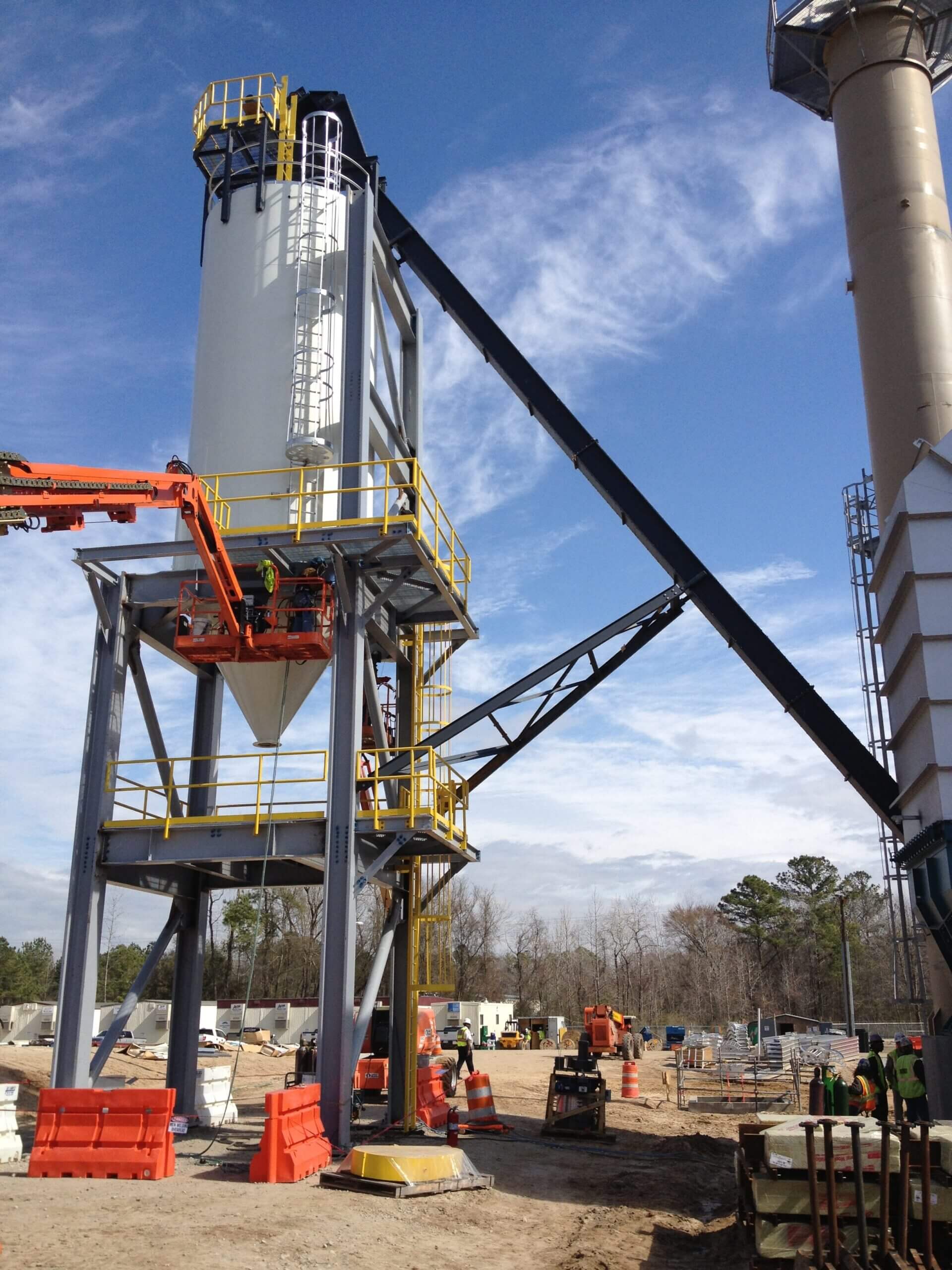 Industrial structure at construction site under blue sky.