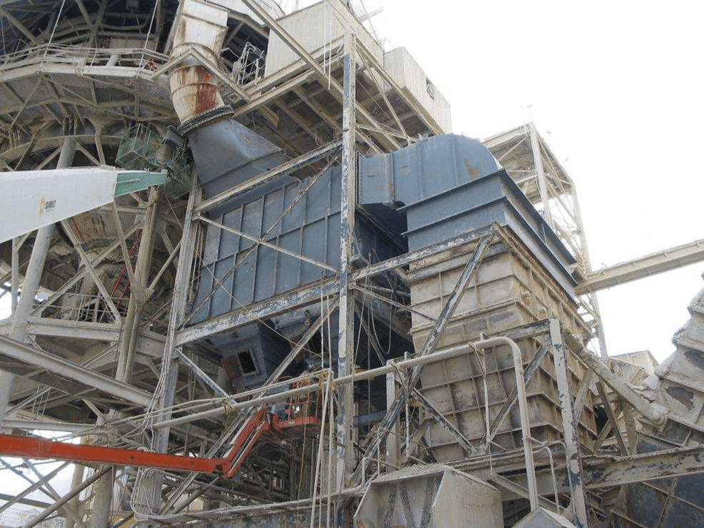 Industrial ductwork and machinery in a processing facility.