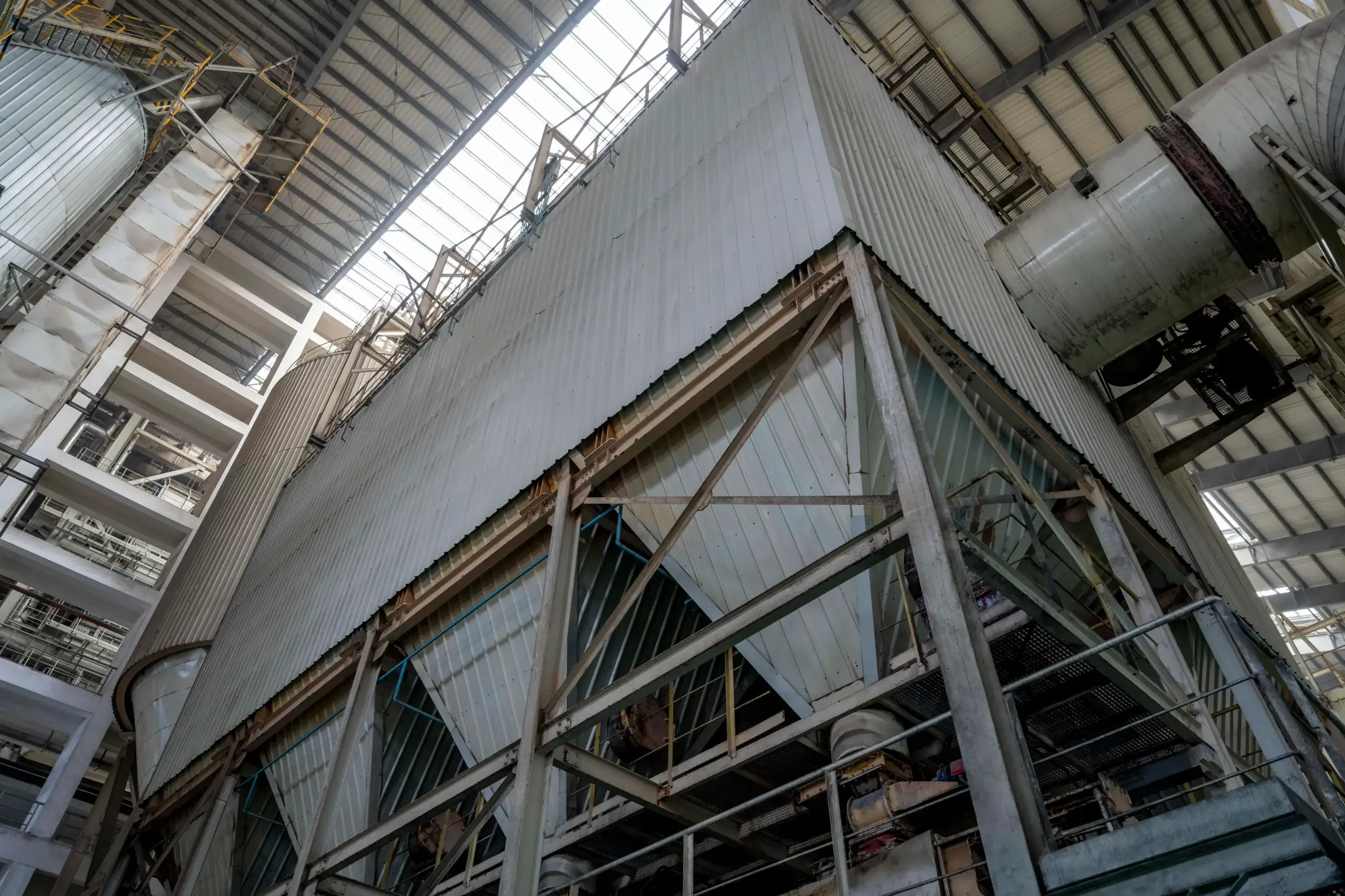 Industrial facility with large metal fuel handling structure.